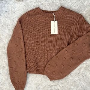 New sweater with detailing on sleeves